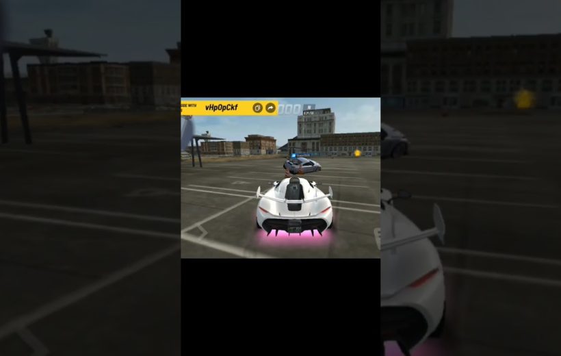 White sports car with pink underglow parked in urban lot beside another vehicle