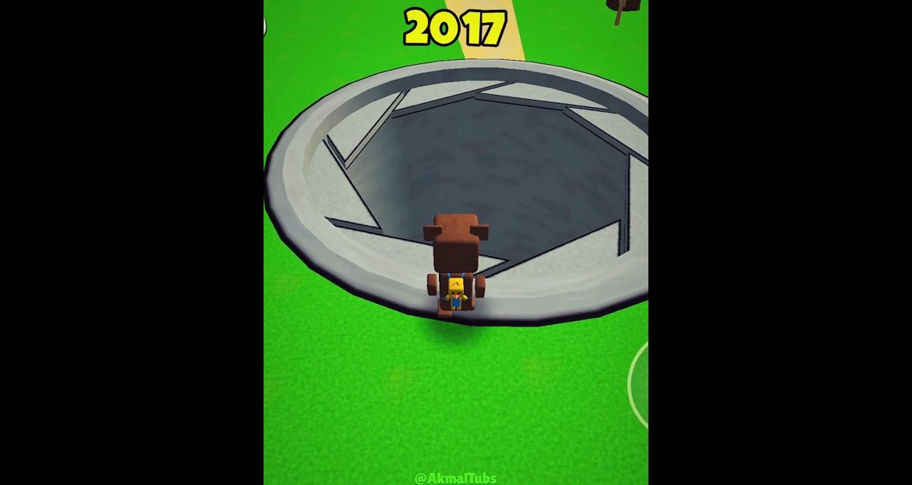 Blocky character standing at edge of a large circular trapdoor labeled 2017 on grass
