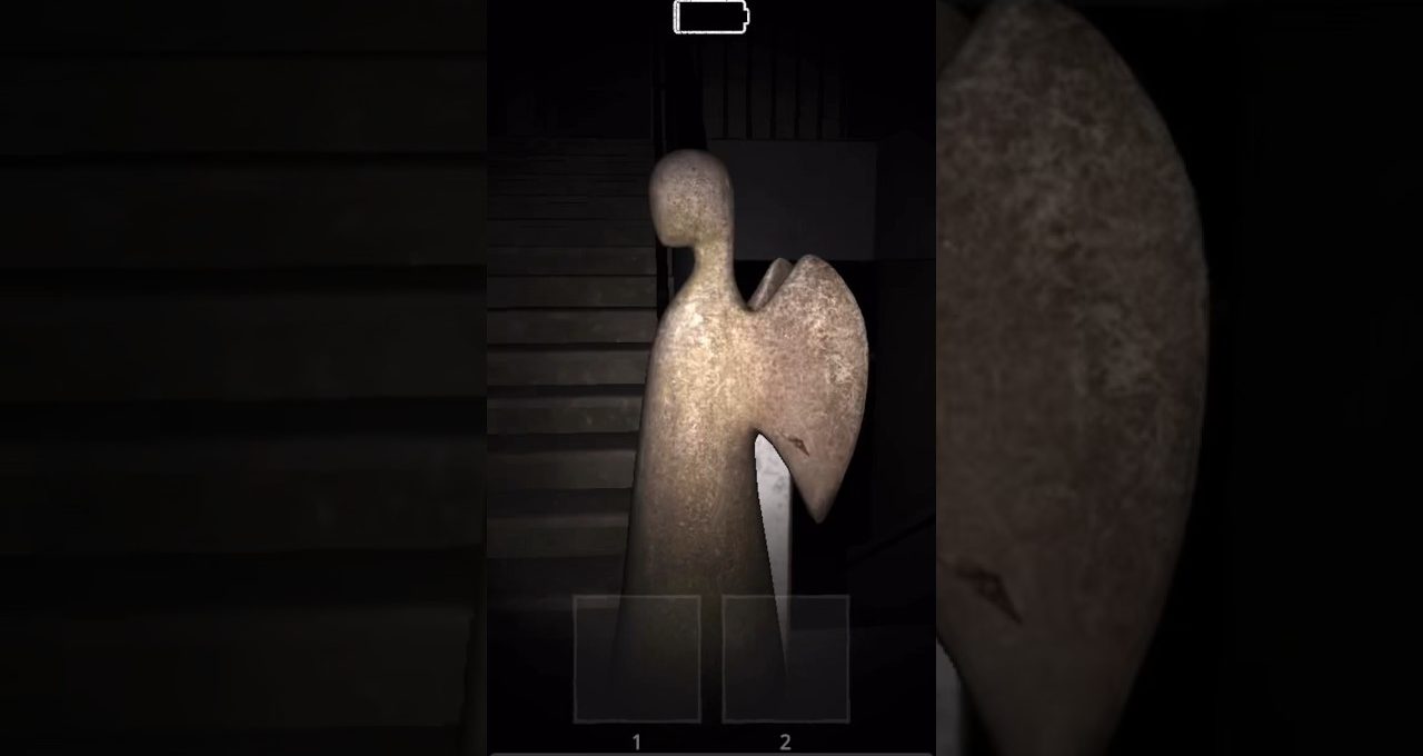 Tall weathered angel statue lit by flashlight standing before a dark stairwell indoors