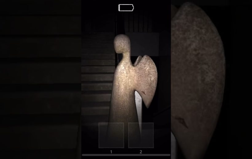 Tall weathered angel statue lit by flashlight standing before a dark stairwell indoors