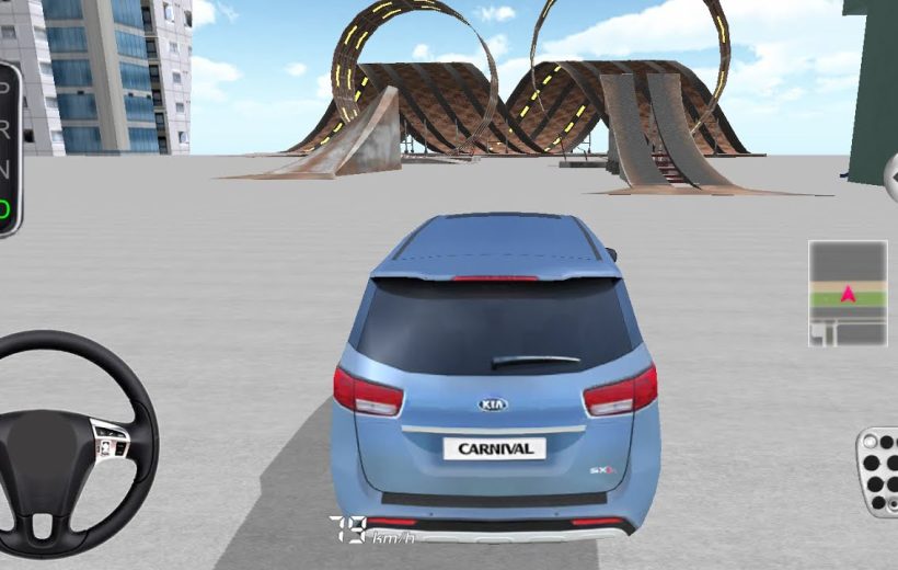 Blue Kia Carnival car facing large stunt ramps in an empty urban parking area