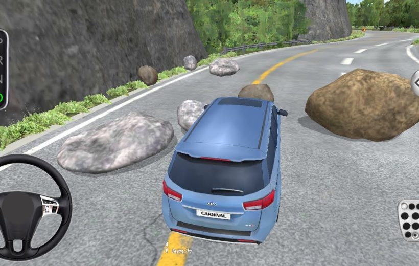 Blue SUV navigating a mountain road strewn with large boulders and rocks.