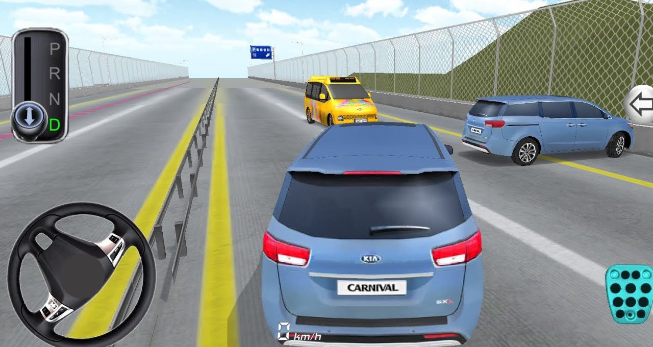 Rear view of a blue Kia Carnival driving on a divided highway with traffic