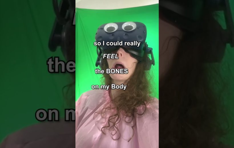 Person wearing VR headset with googly eyes, mouth open against a green screen backdrop