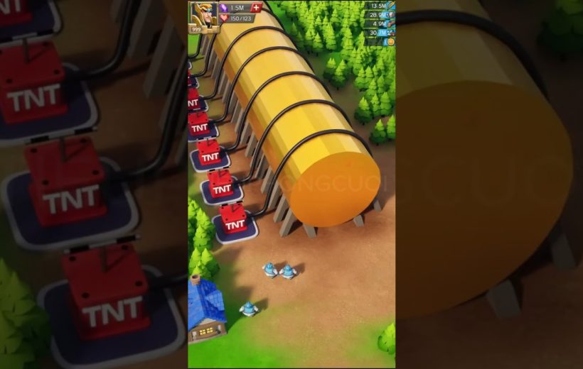 Game scene showing large yellow fuel tanks connected to TNT detonators near trees.