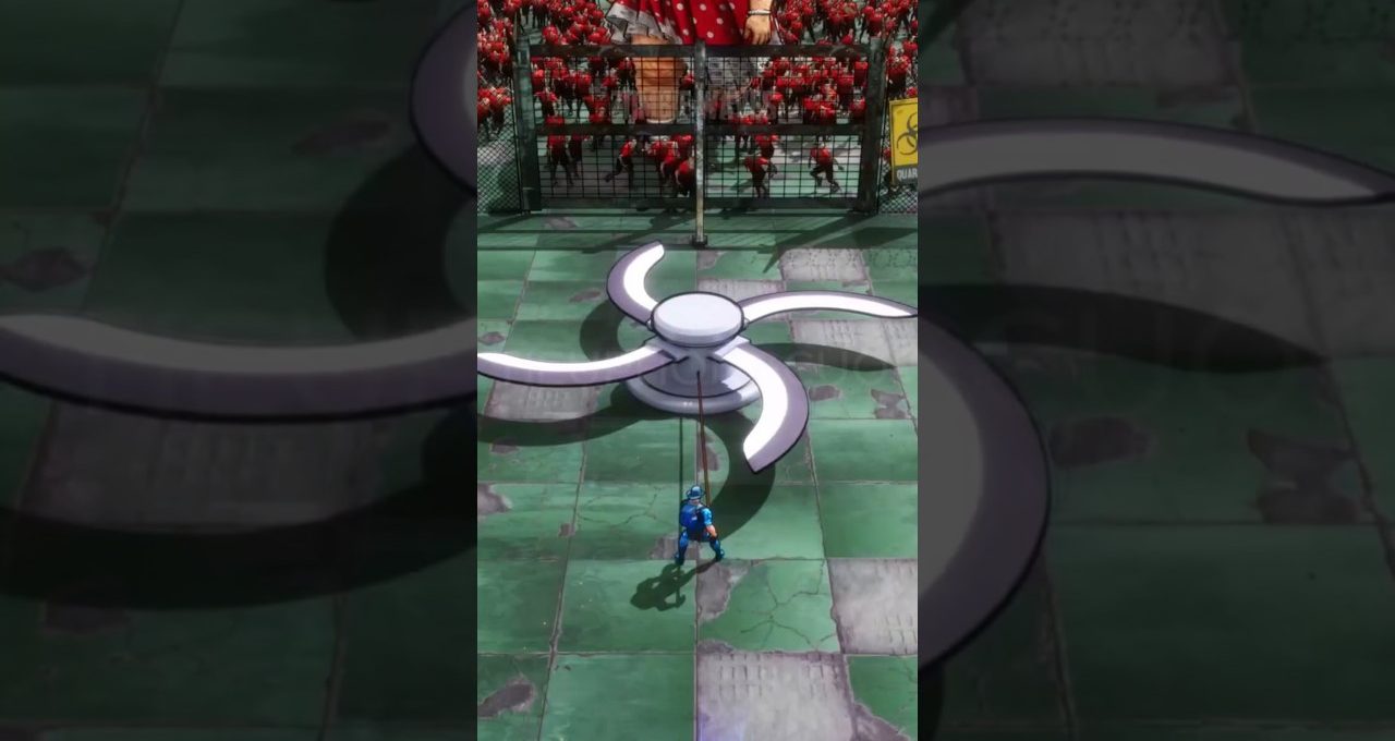 Small blue-suited figure pulling a giant ceiling fan blade in fenced arena