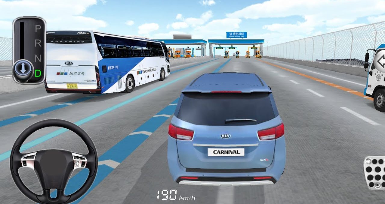Blue Kia Carnival driving toward toll booths on multi-lane highway alongside buses and trucks