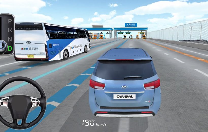 Blue Kia Carnival driving toward toll booths on multi-lane highway alongside buses and trucks