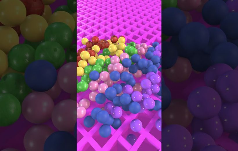 Colorful plastic balls clustered on a pink grid surface, assorted sizes and hues
