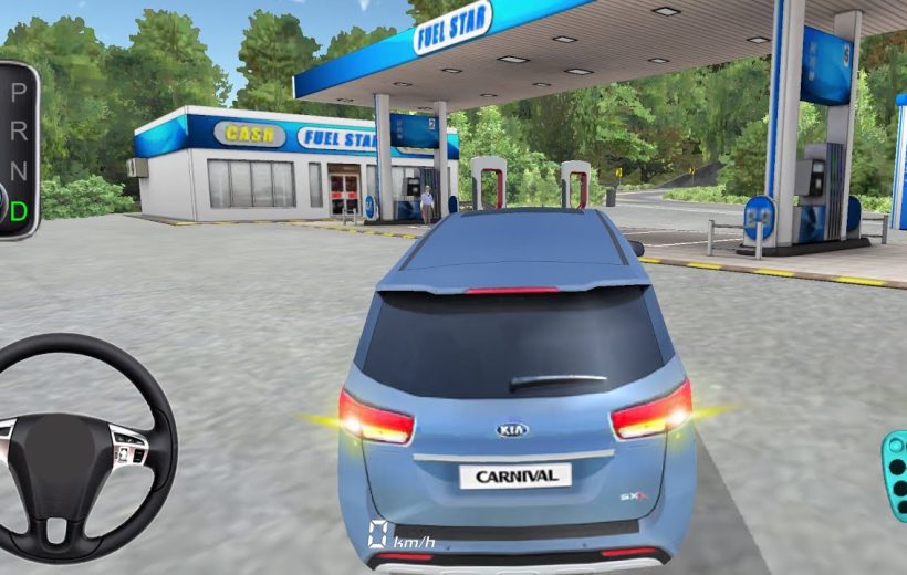 Blue Kia Carnival minivan parked at a fuel station with pumping islands visible