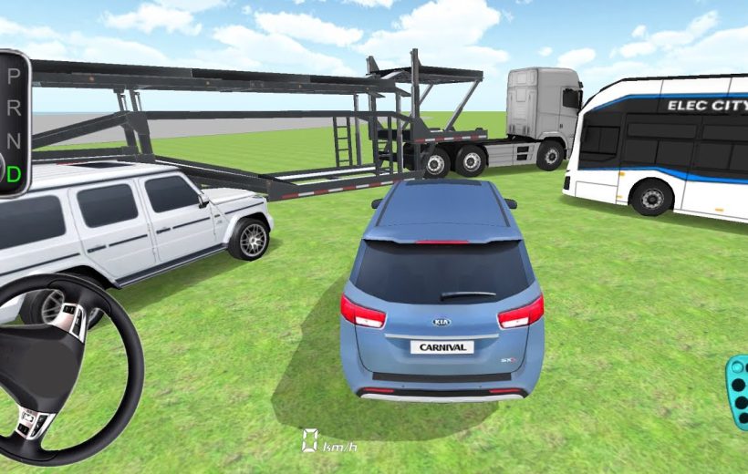 Blue Kia Carnival parked on grass surrounded by various vehicles and car carrier trailer