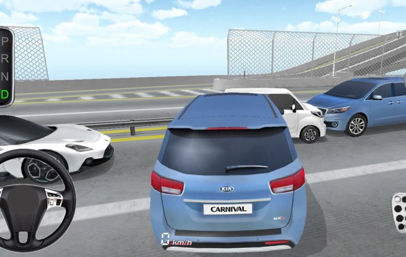 Rear view of blue Kia Carnival van stopped among cars on highway bridge.