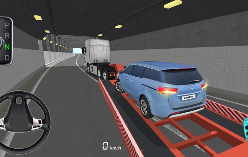 Blue Kia Carnival car loaded on red tow truck platform inside tunnel roadway