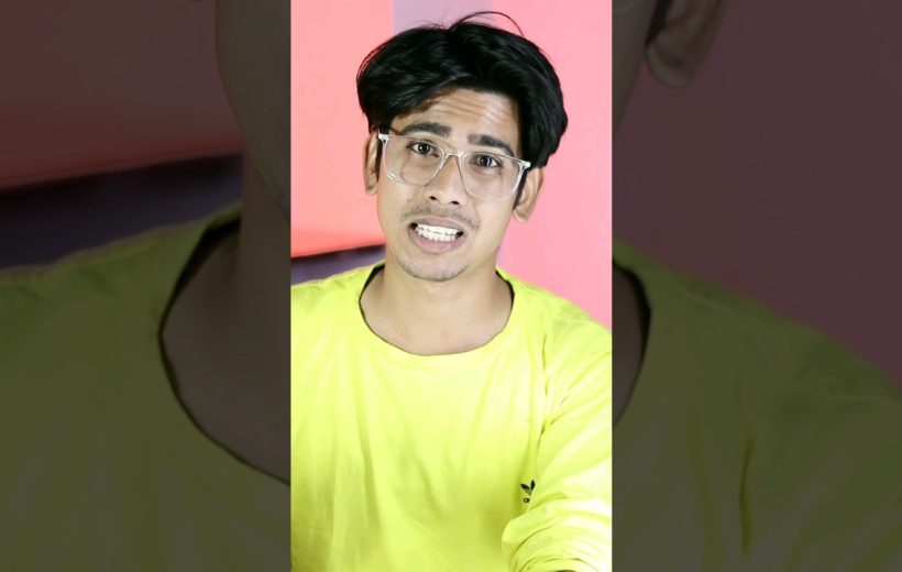 Young man wearing clear glasses and neon yellow shirt speaking against pink background