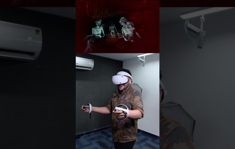 Man wearing VR headset and controllers playing a horror virtual reality game indoors