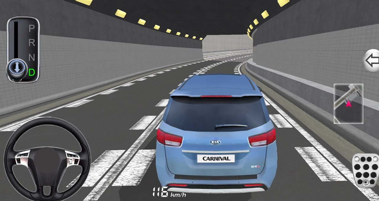 Blue Kia Carnival driving through a lit highway tunnel from third-person rear view