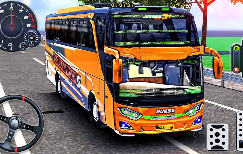 Orange coach bus with steering wheel and dashboard controls on a coastal road