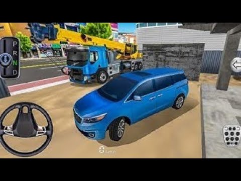 Blue minivan parked in a garage area with a crane truck behind it