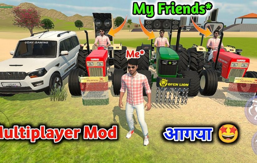 Man standing in front of four tractors and an SUV in a sunny field