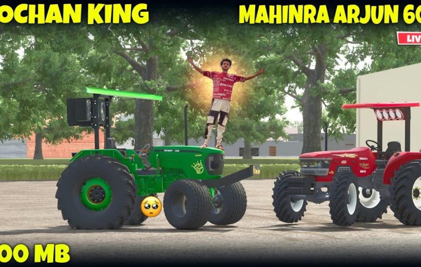 Green and red tractors parked outdoors with person glowing standing on green tractor