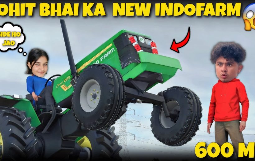 Young woman driving lifted green Indofarm tractor while surprised man watches nearby.