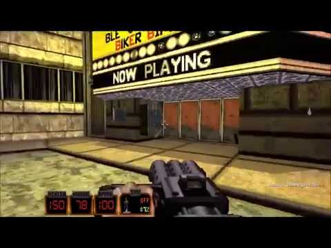 First-person shooter view aiming toward a theater marquee reading "NOW PLAYING"