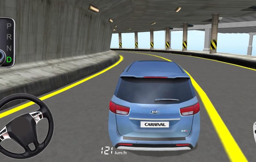 Blue Kia Carnival driving through a curved multi-level concrete parking ramp, rear view