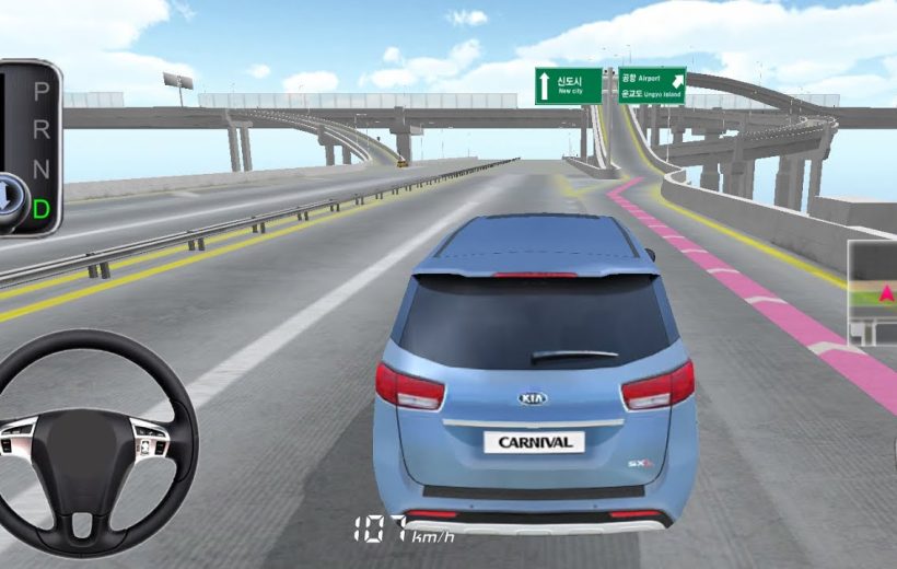 Rear view of a blue Kia Carnival driving on a multi-level highway ramp
