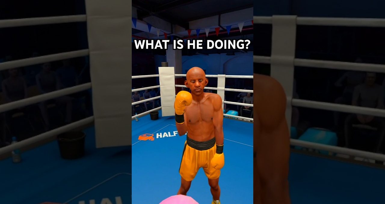 Boxer in yellow shorts and gloves standing in a boxing ring, raising fist.