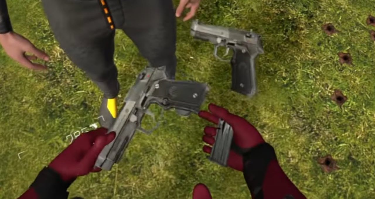 Person wearing red gloves reloads handgun magazine next to another pistol on grass