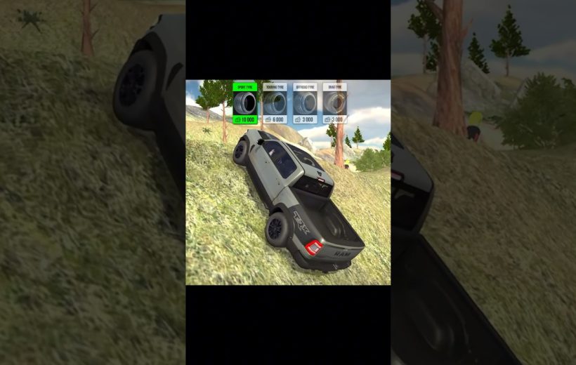 Silver pickup truck climbing grassy hillside in a driving game with tire upgrade options