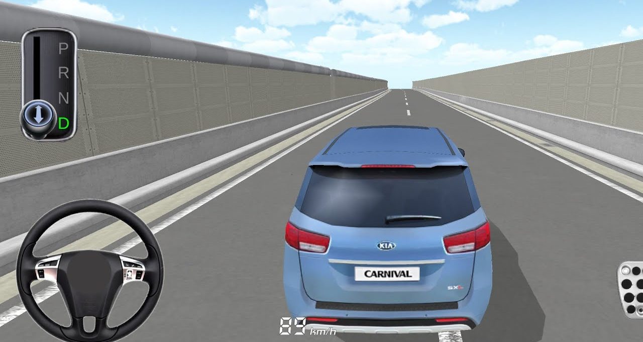 Blue Kia Carnival driving down empty elevated highway seen from rear third-person view