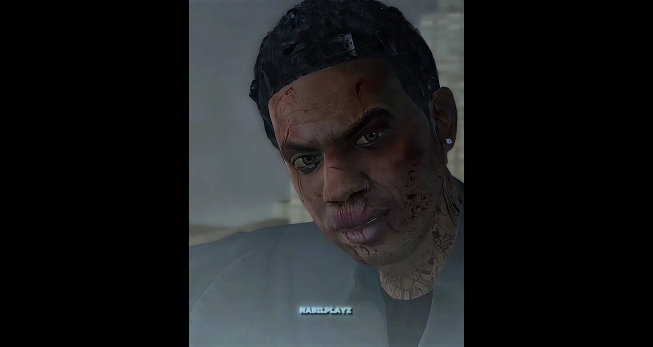 Close-up of a bruised, bloodied man with tattoos and a serious expression