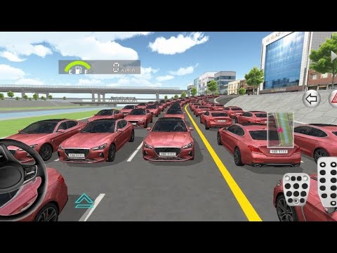 Many identical red sedans lined in multiple lanes on a city road during daytime