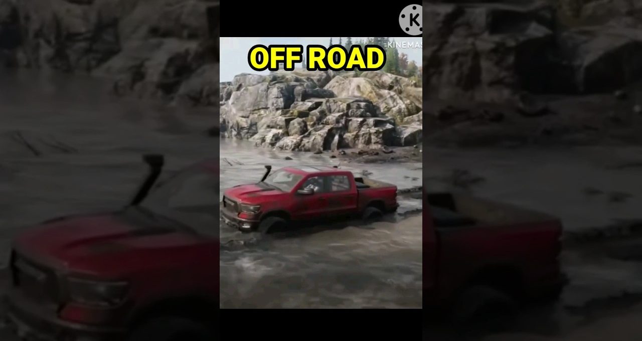 Red pickup truck driving through muddy off-road terrain with rocky cliffs in background