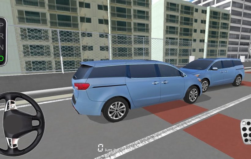 Two blue minivans parked on rooftop parking with city buildings in background