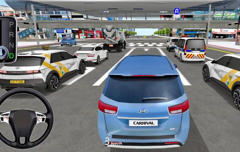 Blue Kia Carnival in traffic at an urban intersection with surrounding vehicles and bridge
