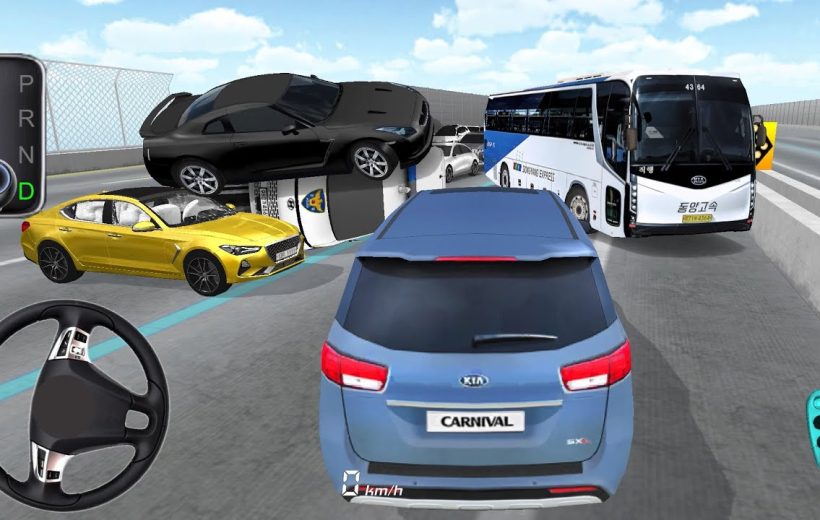 Blue Kia Carnival navigating highway traffic with overturned cars and bus ahead.
