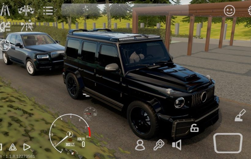 Black luxury SUV parked on driveway with a dark sedan waiting behind it
