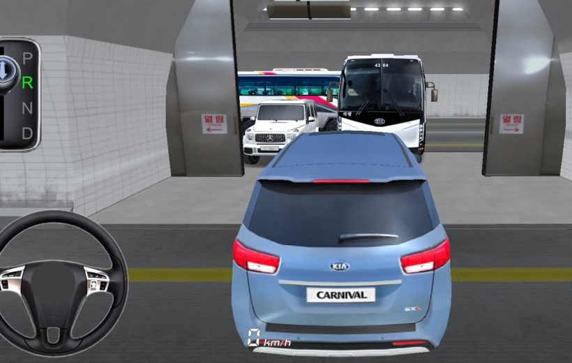 Blue Kia Carnival minivan parked inside a tiled parking garage, bus visible ahead
