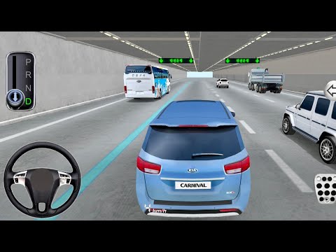 Blue Kia Carnival driving in a multi-lane tunnel with cars, bus, and truck