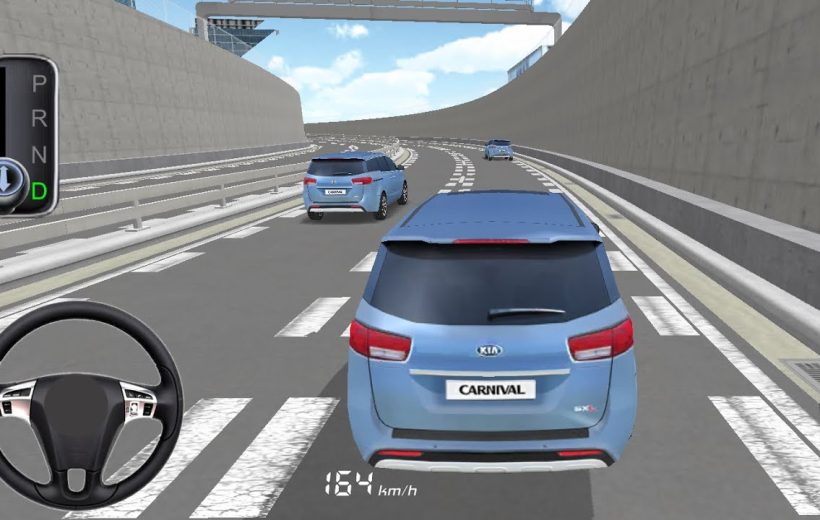 Rear view of a blue Kia Carnival driving along a multi-lane highway tunnel
