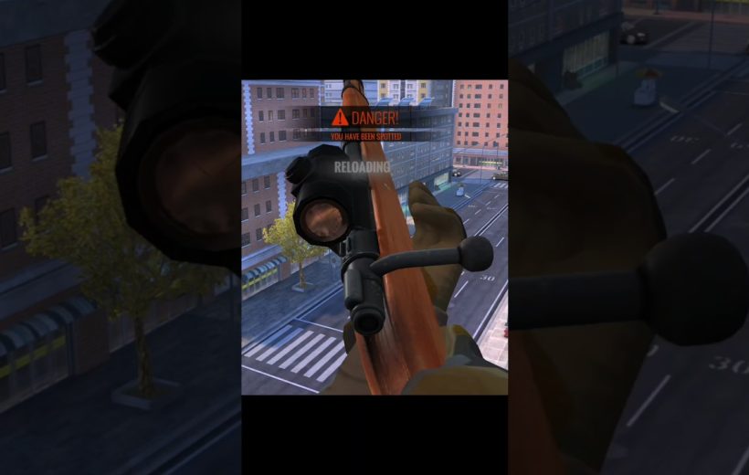 Player view aiming a scoped rifle over a city street with "Danger" warning