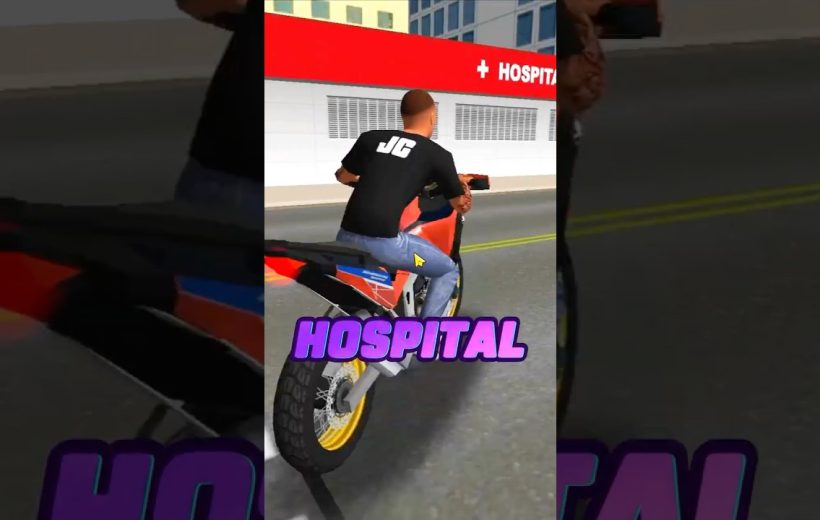 Man riding a sport motorcycle past a hospital building with purple "HOSPITAL" text