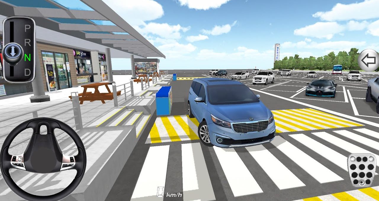 Blue SUV parked at a roadside rest area with picnic tables and parked cars nearby