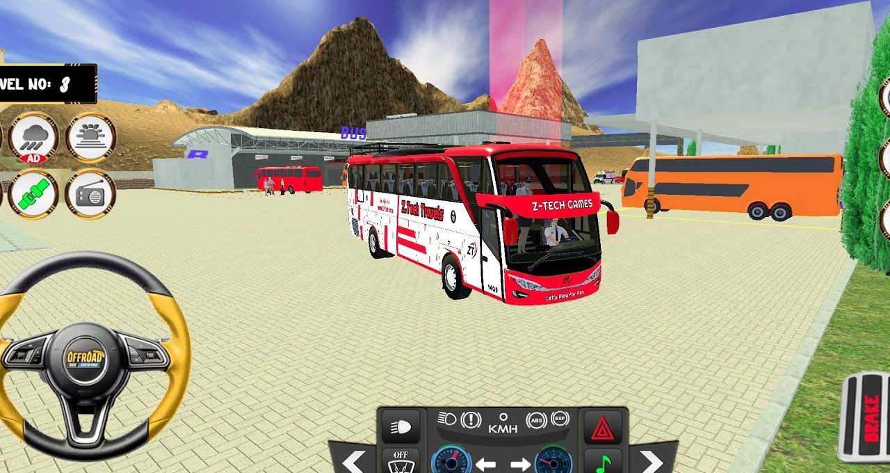 Red and white coach bus parked in a desert bus station with mountains behind
