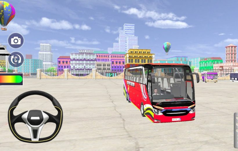 Red coach bus parked in an open city plaza with colorful buildings and balloons