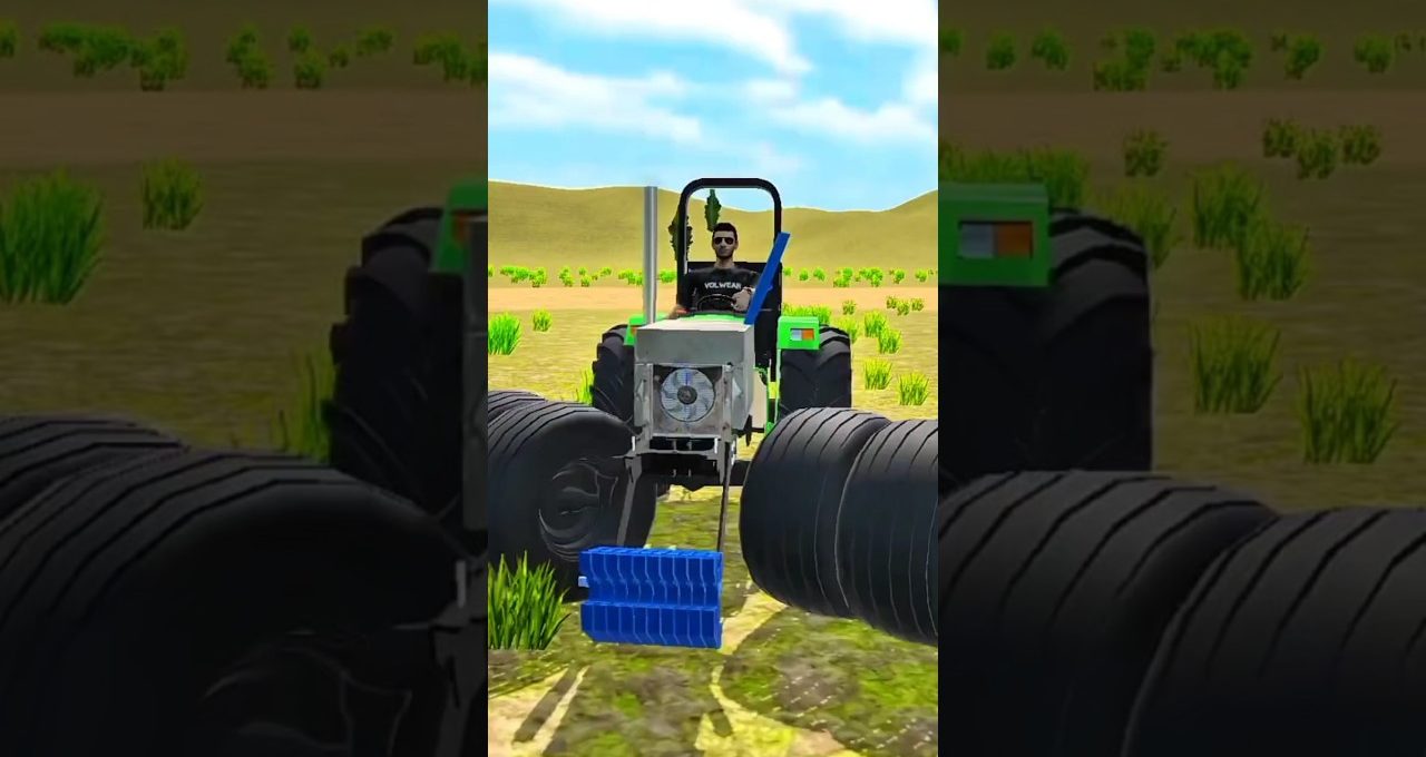 Tractor driver steering a green tractor across a dry field with large tires