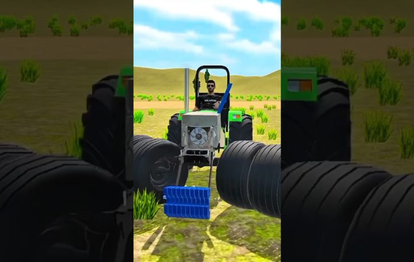 Tractor driver steering a green tractor across a dry field with large tires