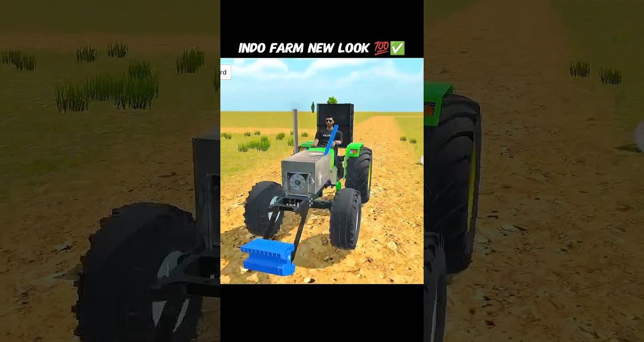 Man driving a modified tractor across a dry field with blue front attachment